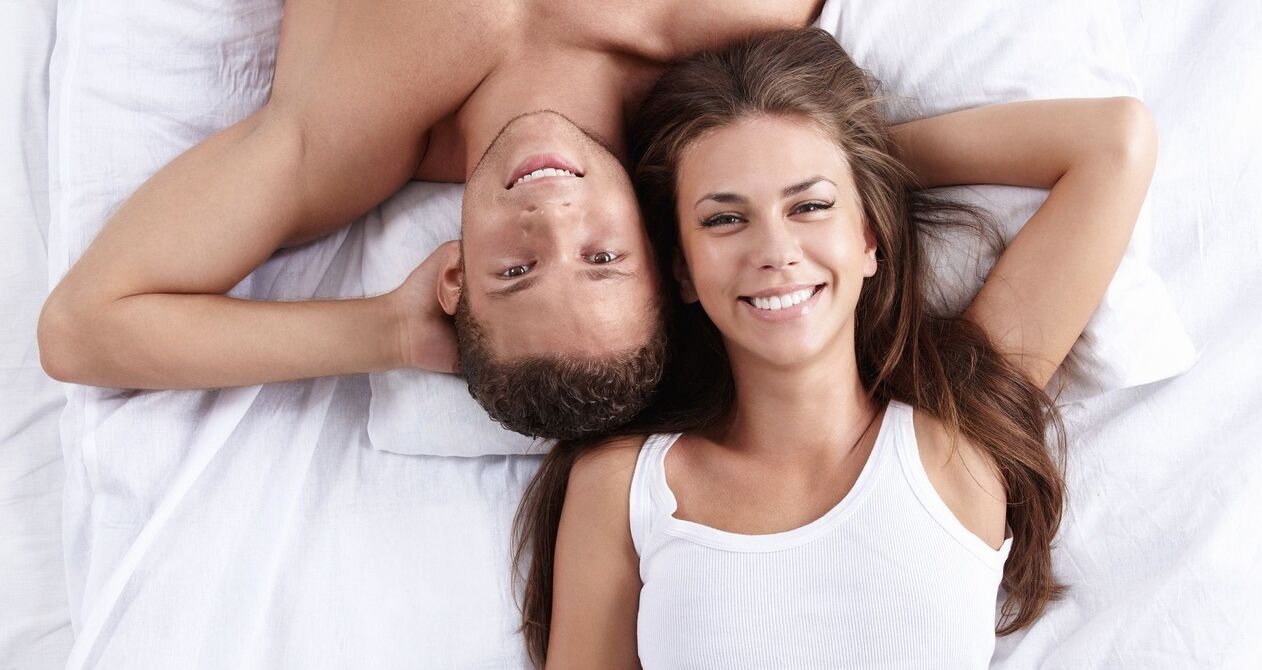 Woman in bed with a man who has greater power.