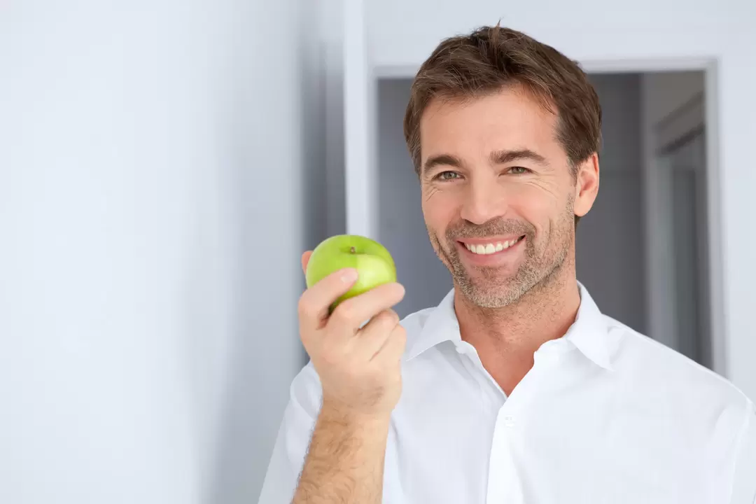 a man eats an apple to have power